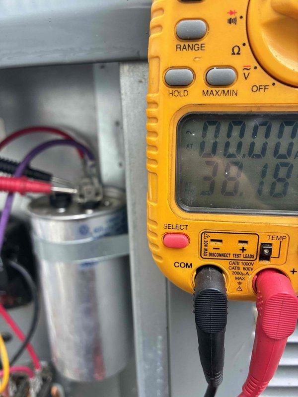 Completed scheduled preventive maintenance on residential cooling system as part of ongoing service plan. Performed electrical diagnostics using digital multimeter to verify capacitor performance and proper voltage readings at 28.8 volts. Inspected outdoor unit components including refrigerant line connections with service valves, ensuring all copper fittings were secure and free from leaks. All system components tested within normal operating parameters and unit returned to service in good working condition.