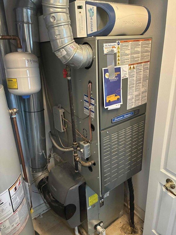Completed scheduled preventive maintenance on residential cooling system including outdoor condenser unit and indoor air handler. Performed comprehensive inspection of American Standard HVAC equipment, verified proper operation of condenser fan and compressor, checked refrigerant levels, and inspected heat exchanger coils for adequate airflow. Cleaned debris and organic material from condenser pad area, examined all electrical connections, and confirmed system is operating within normal parameters for continued reliable cooling performance.
