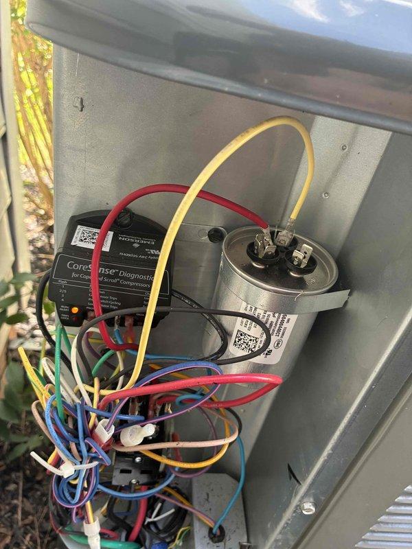 Completed routine cooling maintenance on residential air conditioning system. Performed comprehensive inspection of outdoor condenser unit, verified proper operation of compressor assembly, checked electrical connections and capacitor functionality, and confirmed CoreSense diagnostic monitoring system was operating correctly. All components found in good working condition with no issues identified.
