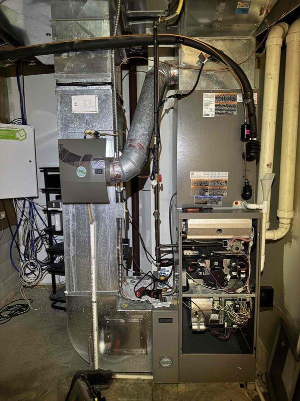 Completed comprehensive cooling system maintenance on residential Lennox air conditioning unit and associated indoor equipment. Performed thorough inspection of outdoor condenser unit, applied specialized coil cleaner to exterior surfaces, verified electrical disconnect operation, and confirmed proper refrigerant line connections. Inspected indoor furnace assembly, ductwork connections, and control panel components to ensure system integration and optimal performance for continued reliable cooling operation.