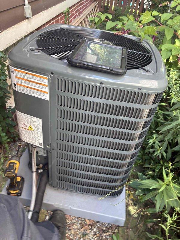 Returned to complete previously interrupted cooling system maintenance after padlock was removed from outdoor disconnect by property owner. Performed comprehensive maintenance inspection of outdoor condenser unit including electrical testing with digital multimeter, verified proper system operation, and documented equipment condition with diagnostic readings.