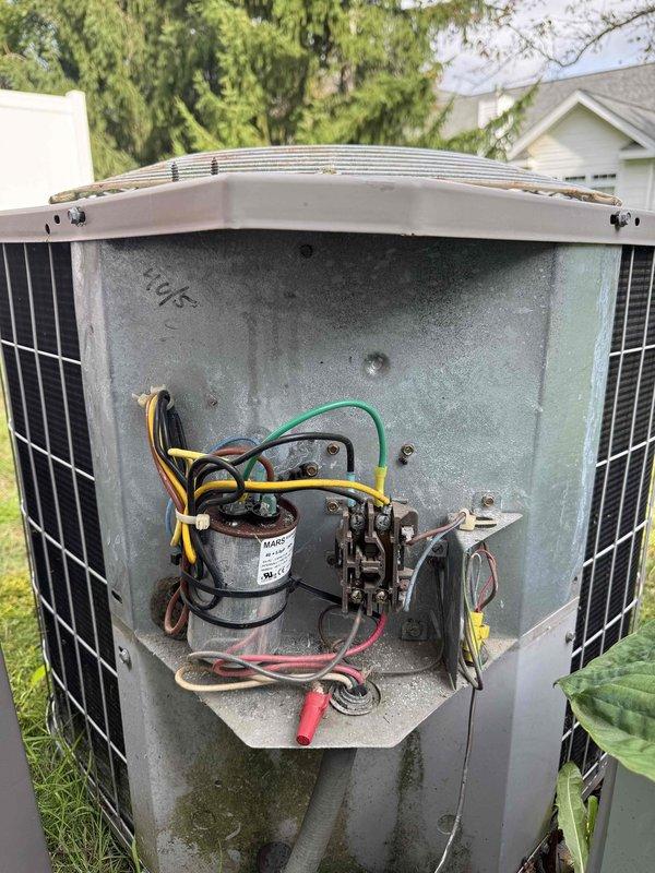 Performed comprehensive heating and cooling system evaluation for new homeowner. Conducted electrical diagnostics using digital multimeter to verify proper voltage and amperage readings at outdoor condensing unit. Inspected capacitor, contactor, and all electrical connections within outdoor unit compartment, confirming all components functioning within manufacturer specifications and wiring secure with no signs of damage or deterioration.