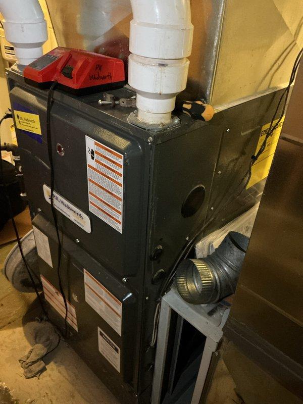 Completed preventive maintenance on two HVAC systems per MVP protocol. Inspected air handler unit in attic space, including ductwork connections, electrical controls, and system operation; noted dust accumulation on unit surfaces typical of attic environment. Serviced second system consisting of furnace and blower assembly in basement location, verifying proper operation of all components, checking PVC venting connections, and confirming system controls functioning correctly. Both systems operational and running within normal parameters upon completion of maintenance procedures.