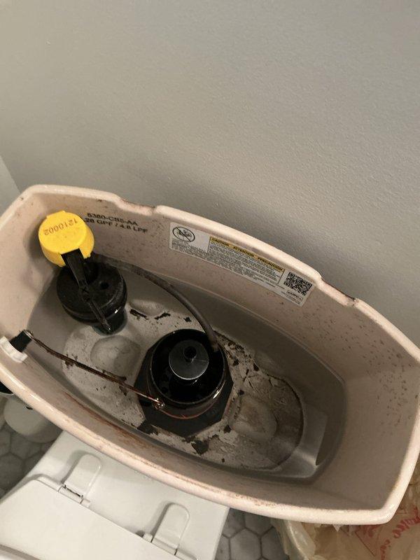 Completed comprehensive whole home plumbing inspection, examining all accessible fixtures, supply lines, and drainage systems throughout the property. Documented toilet tank interior condition showing mineral deposits and discoloration requiring future maintenance attention, and inspected mechanical systems including ductwork and associated plumbing connections in utility areas. All findings photographed for record and future reference.