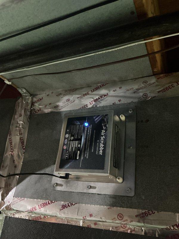 Completed routine cooling maintenance visit on residential HVAC system. Inspected and verified proper operation of outdoor condensing unit, confirmed refrigerant lines and electrical connections were secure, and documented AirScubber air purification system functioning correctly with illuminated LED indicator. All components operating within normal parameters with no issues identified.