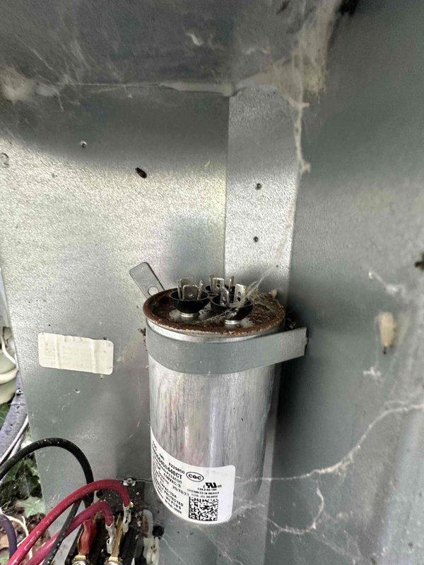 # HVAC Cooling Maintenance - Two Systems

Completed scheduled preventive maintenance on two residential cooling systems. During inspection, identified a failed dual-run capacitor exhibiting severe corrosion and terminal degradation on one unit. Replaced defective capacitor with new OEM component, restoring proper compressor and condenser fan motor operation. Verified electrical connections, tested system startup and operation, and confirmed proper cooling cycle functionality on both units.