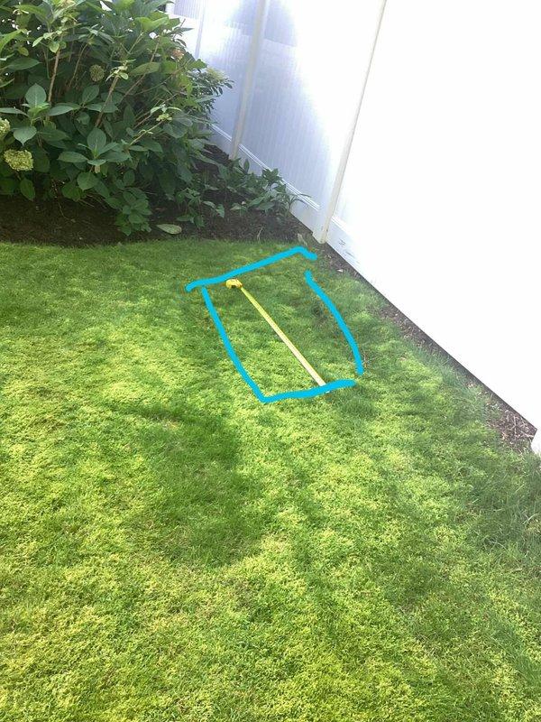 Conducted on-site electrical estimate for residential generator installation in backyard location. Evaluated and documented proposed installation area adjacent to building exterior, measuring and photographing the designated space on lawn near white exterior wall with adequate clearance from landscaping and garden beds. Assessment included verification of access routes, proximity to electrical service entrance, and suitable placement for code-compliant generator pad installation with proper setback requirements from structure and property boundaries.
