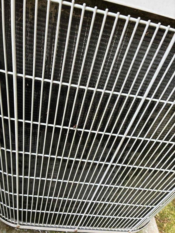 Completed scheduled preventive maintenance on aging cooling system as part of recurring service agreement. Performed comprehensive inspection of outdoor condenser unit, verifying proper operation of all components. Condenser coil found in clean condition with minimal debris accumulation. Measured and recorded system voltage at 24.62 volts, confirming proper control circuit operation. All protective grilles and housing panels intact and secure. Unit operating within normal parameters with no immediate repairs required at time of service.