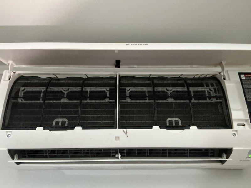 Completed scheduled maintenance on York ductless mini-split cooling system. Inspected wall-mounted indoor air handler unit, accessing internal components by removing front cover panel. Examined air filters which showed moderate dust and dirt accumulation; cleaned filters to restore proper airflow. Inspected evaporator coil assembly and internal components for proper operation. Proceeded to outdoor condenser unit and performed comprehensive inspection of cabinet, fan assembly, and refrigerant line connections. Cleared vegetation and debris from around condenser base to ensure adequate airflow and prevent future obstruction. Verified system operational parameters and confirmed unit cycling properly. All components functioning within normal specifications upon completion of maintenance service.