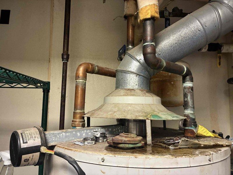 Performed commercial boiler inspection and assessment. Unit exhibited extensive corrosion on tank, piping, and components, with significant oxidation on copper lines and mounting hardware. Based on advanced age, deterioration of critical components, and overall system condition, recommended replacement of unit to prevent imminent failure and ensure continued reliable operation.