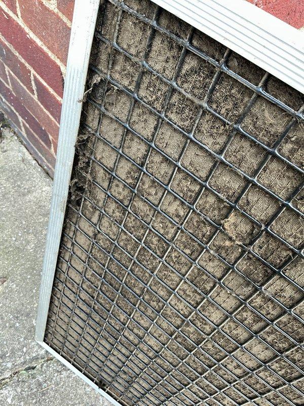 Completed scheduled cooling maintenance visit on residential HVAC system. Inspected and replaced heavily contaminated air filter which showed significant dust and debris accumulation restricting airflow. Removed old insulation material from unit and performed standard system inspection to ensure proper operation and efficiency of cooling equipment.