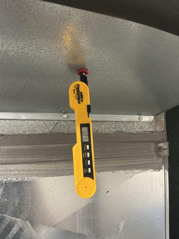 Performed comprehensive maintenance on outdoor HVAC cooling system, including inspection of electrical components, capacitor, and Cor-Sentry device within the condensing unit compartment. Verified system operation through diagnostic testing with calibrated instruments and documented all electrical connections and component conditions for service records.