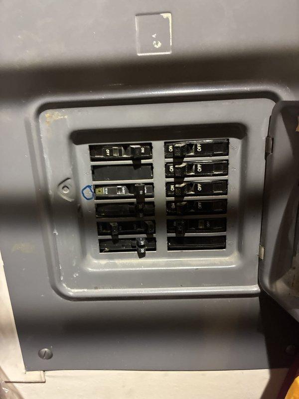 Installed an 8-circuit, 50-amp Square D QO subpanel fed from the main breaker near the boiler system to support two new air conditioning condensers located on opposite sides of the sanctuary. Ran two dedicated 60A 240V circuits using 6 AWG THHN wire—one routed externally along the building exterior wrapping around from the boiler room, and one routed internally through the ceiling—with each circuit extending approximately 50 feet to serve condensers rated at 43-45 amps. Installation included condenser pads, safety disconnects, and proper grounding for both units, completing the electrical infrastructure for dual-zone HVAC system serving high-mount and standard air handlers.