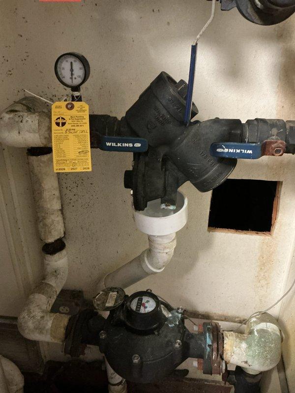 Conducted on-site assessment for water heater and hydronic boiler replacement in commercial facility. Evaluated existing system including backflow preventer assembly with dual shutoff valves, pressure regulation equipment, flow meter, and aging water heater unit with associated ductwork and piping connections. Documented current equipment conditions, photographed plumbing infrastructure and mechanical components, and provided replacement options to client for upgrading the heating and hot water system.