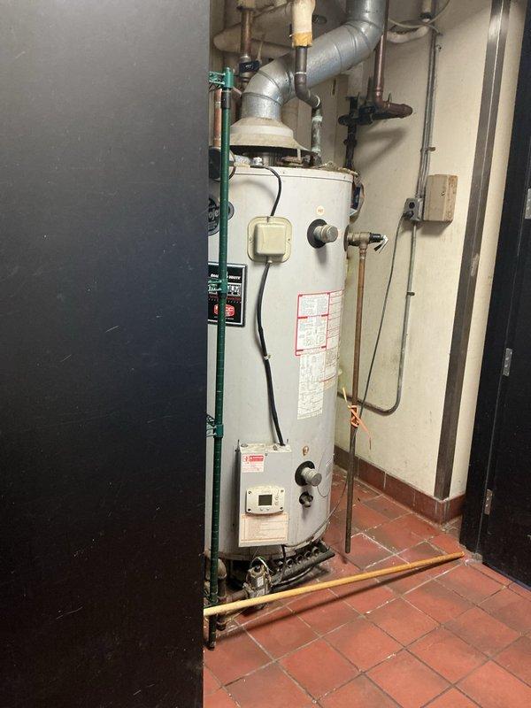 Conducted on-site assessment for water heater and hydronic boiler replacement in commercial facility. Evaluated existing system including backflow preventer assembly with dual shutoff valves, pressure regulation equipment, flow meter, and aging water heater unit with associated ductwork and piping connections. Documented current equipment conditions, photographed plumbing infrastructure and mechanical components, and provided replacement options to client for upgrading the heating and hot water system.