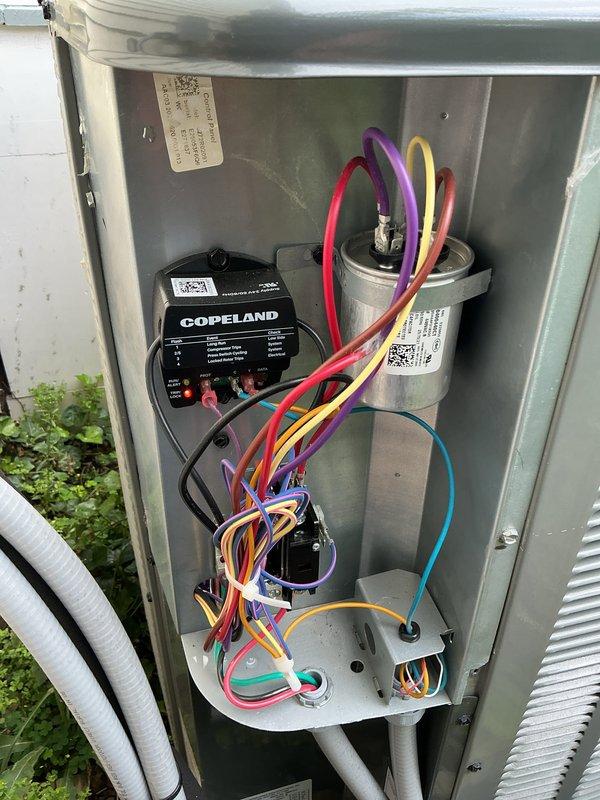 Completed first-year MVP maintenance visit on outdoor cooling system. Performed comprehensive inspection of all electrical components including Copeland compressor module, capacitor, contactor, and associated wiring connections. Verified proper operation of all system components, checked electrical connections for tightness and signs of wear, and confirmed unit is functioning within normal parameters. System operating efficiently with no issues identified during maintenance inspection.