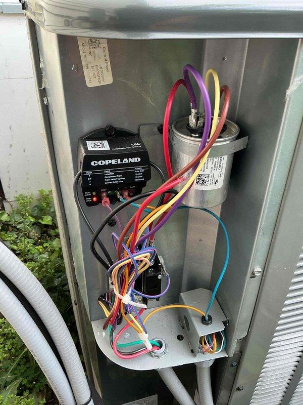 Completed first-year MVP maintenance visit on outdoor cooling system. Performed comprehensive inspection of all electrical components including Copeland compressor module, capacitor, contactor, and associated wiring connections. Verified proper operation of all system components, checked electrical connections for tightness and signs of wear, and confirmed unit is functioning within normal parameters. System operating efficiently with no issues identified during maintenance inspection.