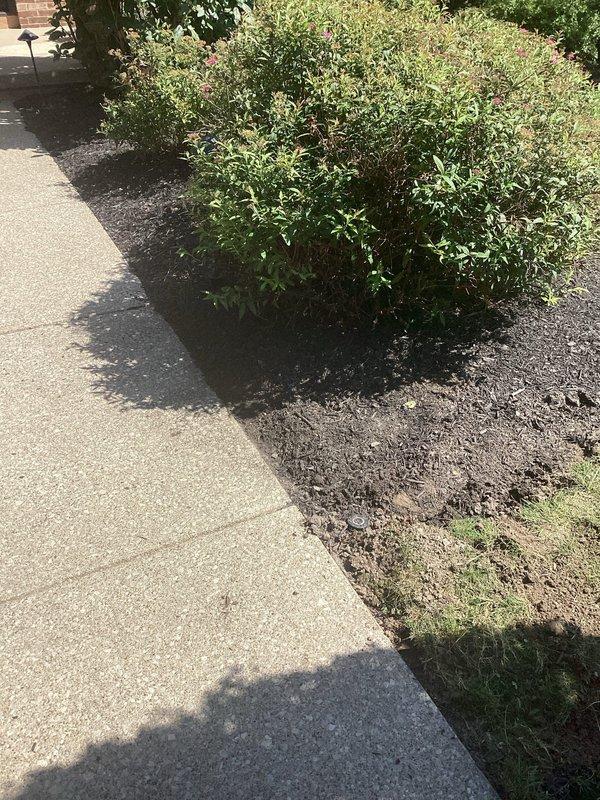 Retrenched low voltage wiring to outdoor landscape light fixture and installed new transformer. Replaced damaged or deteriorated underground cable run and restored proper power supply to pole-mounted light along landscaped walkway area.
