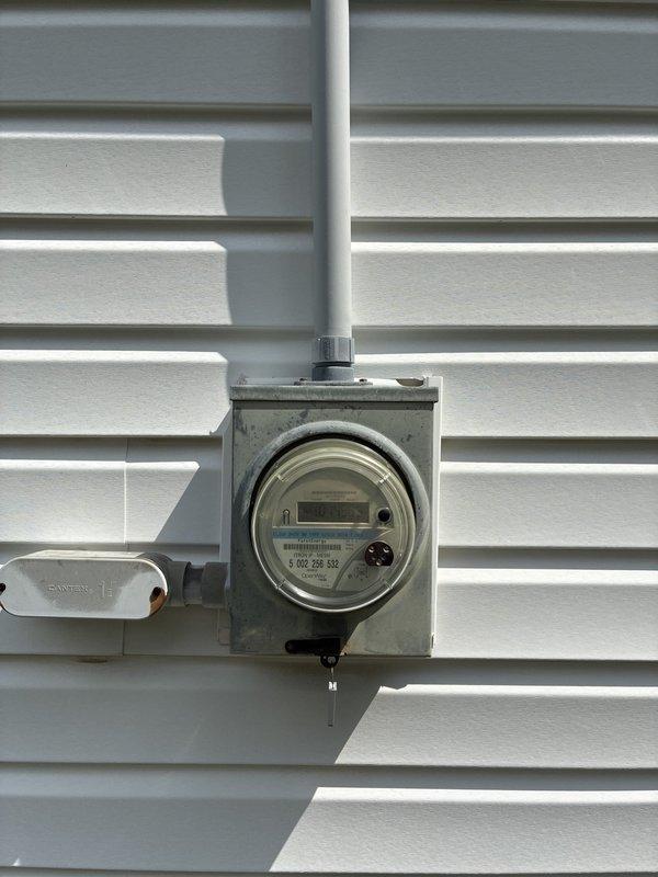 Conducted on-site assessment for furnace replacement options at residential property with easy access to equipment. Documented existing electrical infrastructure including main service panel and exterior meter configuration to ensure compatibility with proposed HVAC system upgrades.