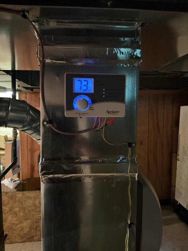 Completed scheduled preventive maintenance on residential cooling system. Performed comprehensive inspection of air handler unit, verified Aprilaire thermostat operation displaying proper temperature reading, checked all electrical connections and control wiring, inspected condensate drainage system and PVC piping with proper valve function, and confirmed all system components operating within normal parameters.