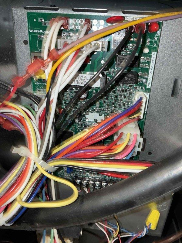 Completed scheduled preventive maintenance on split system central air conditioning unit rated at 13.4 SEER. Performed comprehensive electrical diagnostics using clamp meter to verify proper amperage draw and system performance parameters. Inspected and tested White-Rodgers control board assembly, confirming all relay functions, wiring connections, and safety circuits operating within manufacturer specifications. All components found in satisfactory working condition with no repairs required.