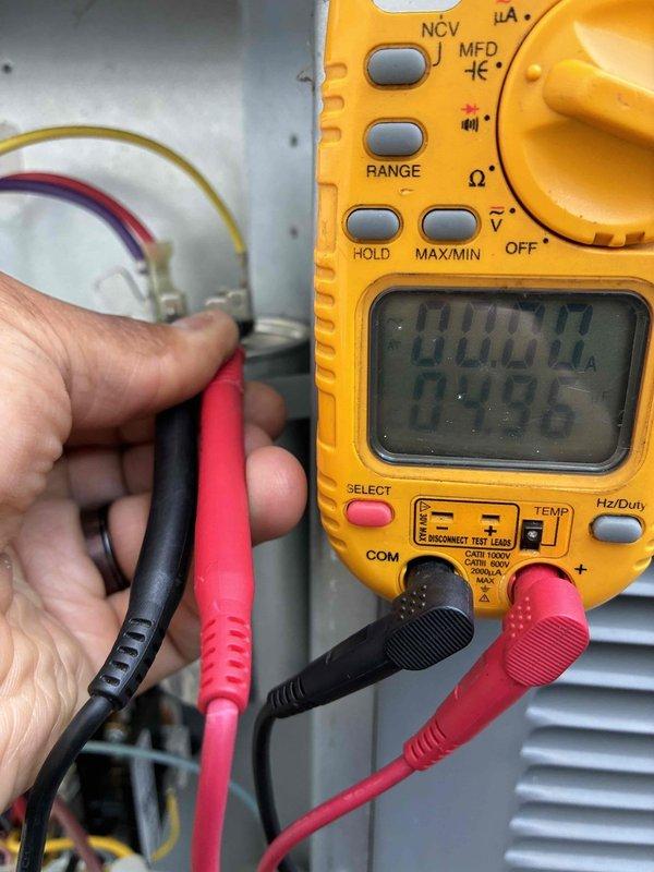 # HVAC Cooling System Maintenance

Completed routine preventive maintenance on residential cooling system as part of ongoing service plan. Performed comprehensive electrical diagnostics on system components, including capacitor testing using digital multimeter to verify proper voltage and capacitance readings. Measured electrical values at capacitor terminals, confirming operational parameters were within manufacturer specifications at 218V and 20.00 microfarads. Inspected all electrical connections, wiring, and control components for signs of wear or deterioration. All tested components functioning properly with no deficiencies noted. System operational and ready for continued service.