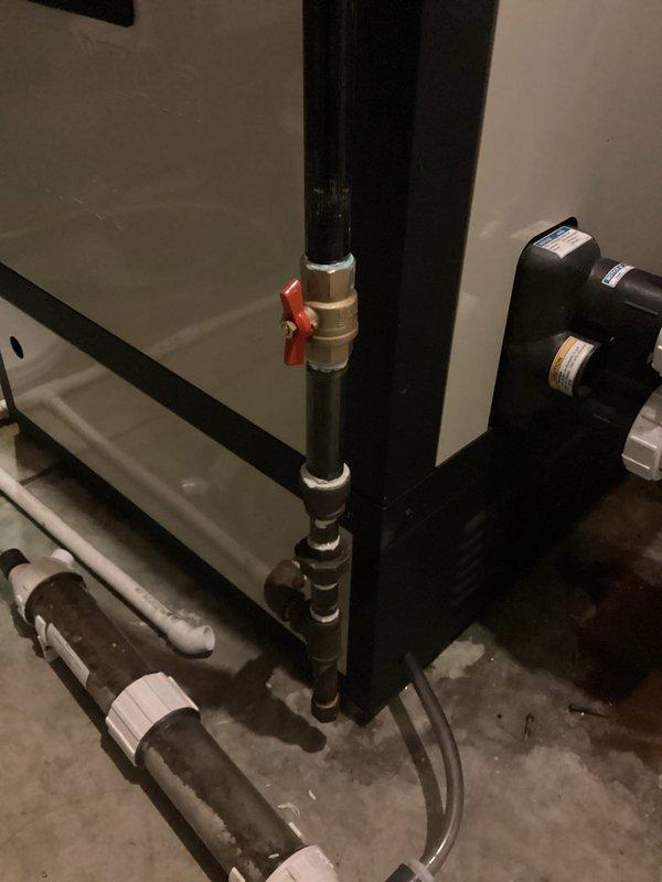 Replaced gas shut-off valve with new brass ball valve assembly on black iron gas supply line. Installation included proper threading, sealing, and testing of all connections to ensure leak-free operation and code compliance.