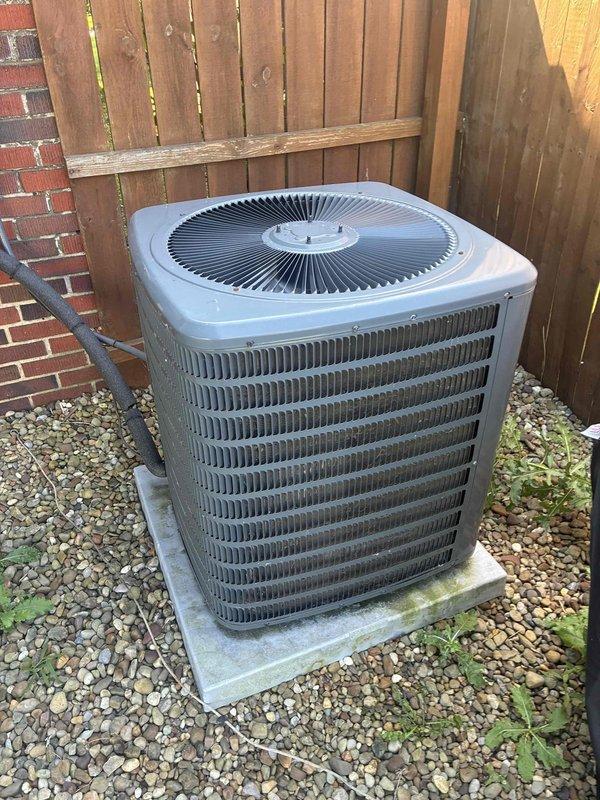 Completed scheduled preventative cooling maintenance on residential air conditioning system. Performed comprehensive inspection of outdoor condenser unit, including examination of heat exchanger coils, fan operation, and electrical connections. Unit found to be operating within normal parameters with adequate airflow through louvered fins and proper fan blade rotation. Noted minor vegetation growth around unit base on gravel pad; recommended maintaining clearance for optimal performance.