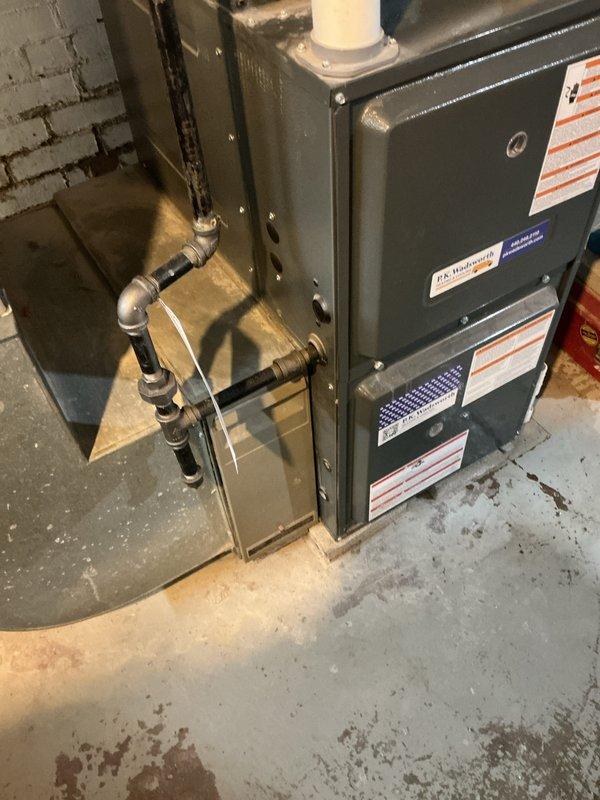 Completed scheduled cooling system maintenance on residential HVAC unit installed in basement utility area. Performed comprehensive inspection of furnace, ductwork, and associated components including PVC vent piping, refrigerant lines, and electrical connections. All systems operating within manufacturer specifications with no deficiencies noted at time of service.