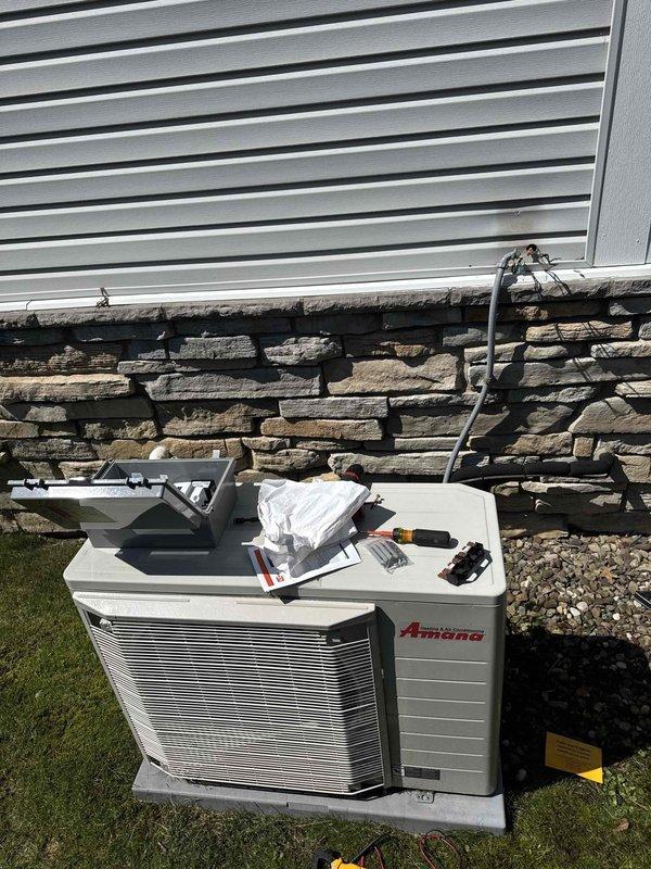 Completed installation of dehumidifier system with three electrical disconnects for whole-home humidity control. Integrated new equipment with existing Carrier air handler in basement and Amana outdoor condenser unit, ensuring proper electrical connections and system compatibility for enhanced indoor air quality management.