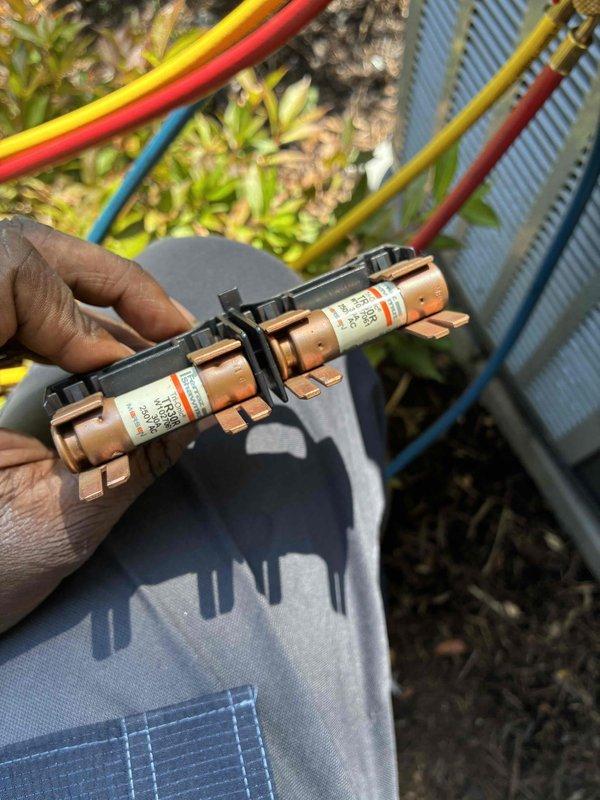 Completed routine cooling maintenance on HVAC system equipped with Copeland Scroll compressor and CoreSense diagnostic monitoring. Inspected CoreSense diagnostic module, verified proper LED indicator function and wiring connections, examined electrical fuse assembly with blade-type fuses in fuse block, and confirmed all safety devices and electrical components were operating within normal parameters.