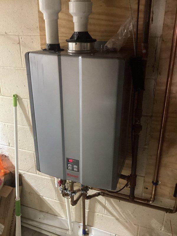 Replaced failed heat exchanger and control board on Rinnai tankless water heater. Unit was disassembled to access internal components, defective heat exchanger and control board were removed and replaced with new parts, then system was reassembled, tested for proper operation, and returned to service.