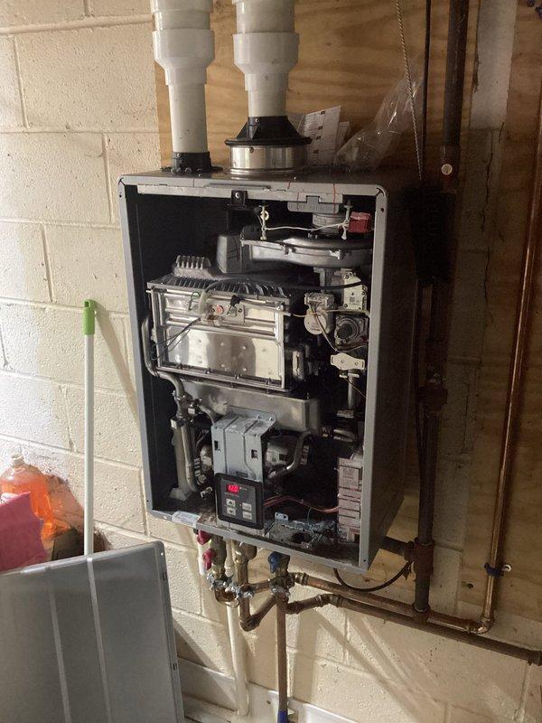 Replaced failed heat exchanger and control board on Rinnai tankless water heater. Unit was disassembled to access internal components, defective heat exchanger and control board were removed and replaced with new parts, then system was reassembled, tested for proper operation, and returned to service.