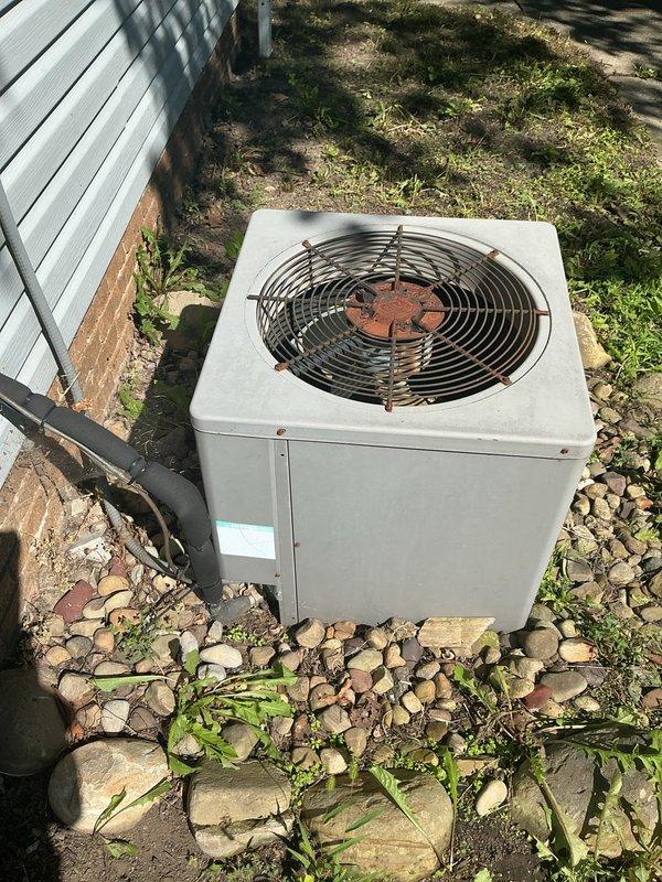 # HVAC Cooling Maintenance Completed

Performed comprehensive preventive maintenance service on residential split-system air conditioning unit as part of recurring maintenance program. Conducted thorough inspection of outdoor condenser unit, which showed weathering and oxidation on fan components but remained structurally sound and operational. Verified proper airflow through condenser coil and fan assembly. 

Inspected indoor air handler components and monitored refrigerant line temperatures using calibrated digital thermometer, recording supply line temperature of 80.61°F. Observed normal condensation formation on refrigerant lines, indicating proper system operation and heat transfer. Verified service documentation and maintenance sticker placement for future reference. Confirmed system operating within normal parameters with adequate cooling capacity. All components functioning as designed with no immediate repairs required.