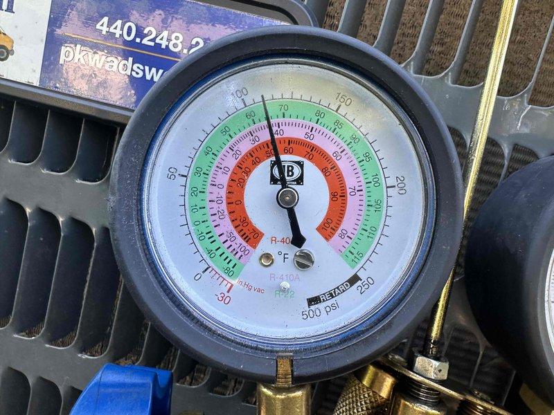 Performed cooling maintenance on Unit A as part of seasonal tune-up service. Conducted electrical diagnostics using digital clamp meter, verifying amperage readings and system performance. Checked refrigerant pressures on R-410A system using manifold gauges, with readings observed in normal operating range. Inspected condenser coil condition and overall unit operation to ensure system readiness for cooling season.