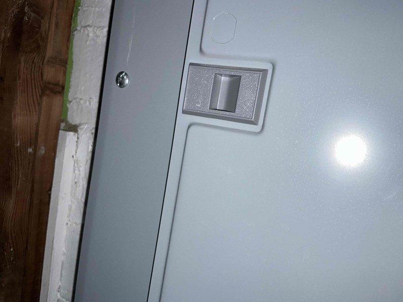 Conducted on-site evaluation and provided furnace replacement options for residential heating system. Assessed existing gray metal furnace unit installed in basement utility area with white PVC exhaust venting system and documented current equipment configuration including associated water heater. Reviewed electrical service panel requirements and photographed existing installation to support equipment replacement recommendations and ensure proper system specifications for future installation.