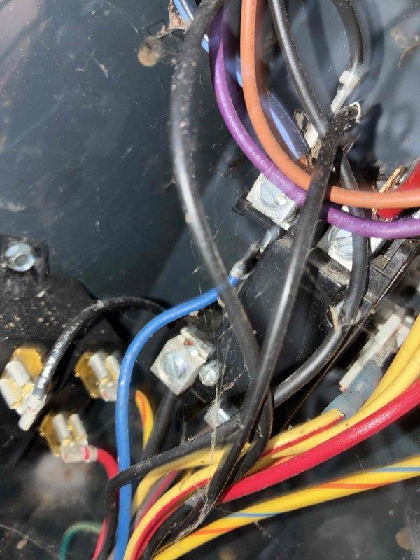 # HVAC Cooling Maintenance - 10+ Years Old Unit

Performed comprehensive preventive maintenance on aging cooling system. Upon inspection, discovered significant frost and ice accumulation on refrigerant lines and evaporator coils, indicating potential airflow restriction or refrigerant charge issues. Documented electrical connections and wiring configuration, noting multiple wire terminations at junction block with proper color coding and secure cable management via zip ties. Inspected brass fittings and copper refrigerant line connections for integrity. Captured photographic documentation of frosted coil conditions and electrical component layout for maintenance records. System evaluated under MVP maintenance program protocol.