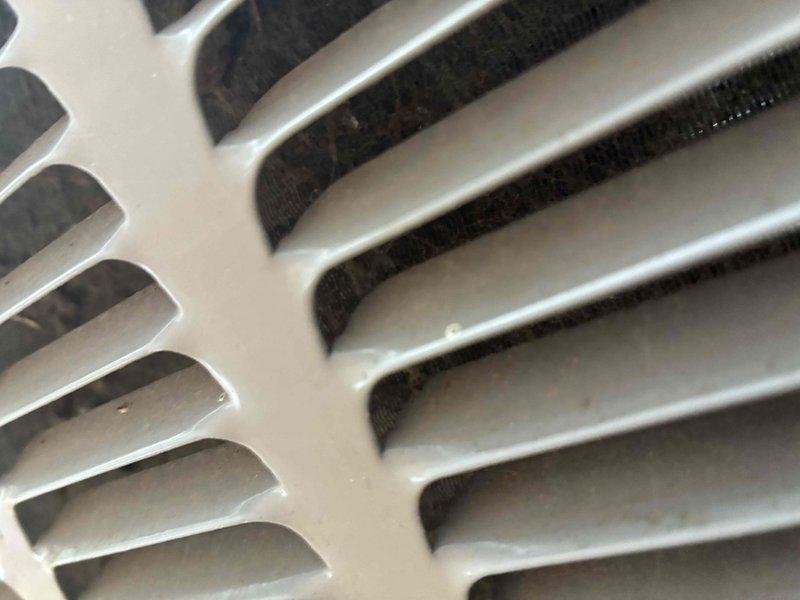 Completed scheduled preventive maintenance on residential cooling system as part of ongoing service agreement. Performed comprehensive inspection of evaporator coil assembly and heat exchanger fins, noting minor dust accumulation on coil surfaces and supply register. Verified proper airflow through ventilation grilles and documented system condition through photographic records. All components found operating within normal parameters with no immediate service needs identified.