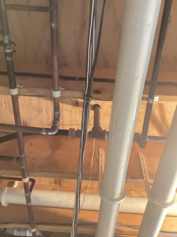 Conducted on-site electrical assessment for generator installation. Evaluated existing electrical infrastructure and gas service locations, documented current utility entry points and routing requirements. Reviewed building layout including electrical panel location and potential generator placement near structure. Assessed ceiling-level electrical conduit and utility pipe routing to determine optimal connection pathways for generator integration with existing electrical system.