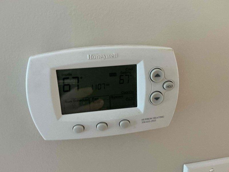 Conducted on-site assessment of existing heating system in residential property to provide replacement estimate. Evaluated current furnace installation in basement utility area, documented existing Honeywell digital thermostat controls, and photographed mechanical room layout including ductwork configuration and available space for new equipment installation. Provided homeowner with equipment options and pricing for complete heating system replacement.