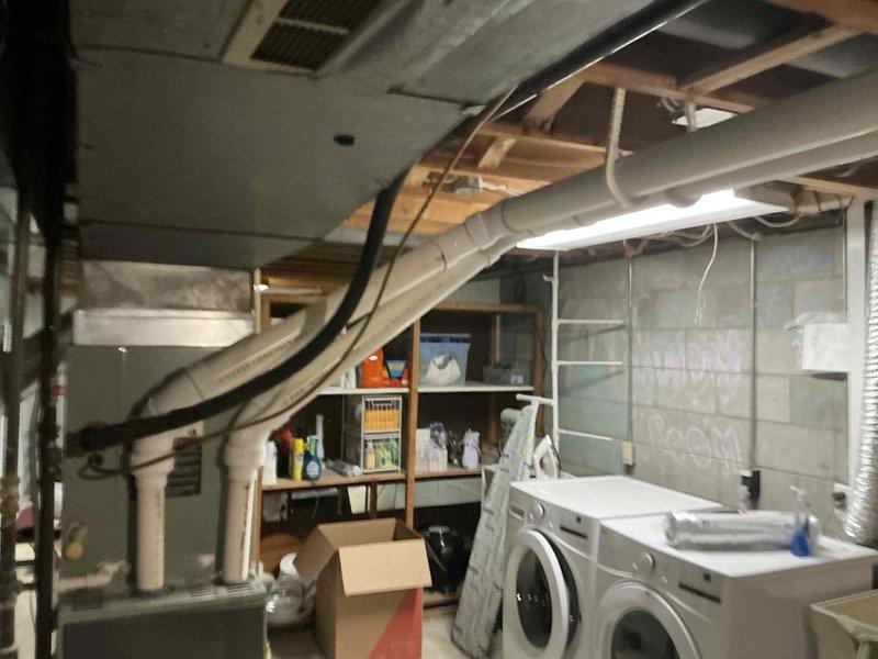 Conducted on-site assessment of existing heating system in residential property to provide replacement estimate. Evaluated current furnace installation in basement utility area, documented existing Honeywell digital thermostat controls, and photographed mechanical room layout including ductwork configuration and available space for new equipment installation. Provided homeowner with equipment options and pricing for complete heating system replacement.