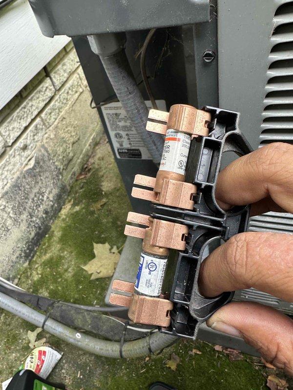 # HVAC Cooling System Maintenance

Performed comprehensive preventive maintenance on residential air conditioning system. Conducted thorough inspection of indoor air handler unit, examining blower motor assembly, electrical connections, and associated wiring harnesses for proper operation and secure mounting. Verified all wire terminations at motor connections were tight and free from signs of overheating or corrosion.

Inspected outdoor condensing unit components, including electrical disconnect switch and fuse assembly. Removed and examined fuse block containing dual-element time-delay fuses, confirming proper amperage ratings and fuse integrity. All fuses tested within normal operating parameters with no signs of degradation or failure. Reinstalled disconnect components and verified secure fit.

System operational testing confirmed normal start-up sequence, proper airflow, and adequate cooling performance. All safety controls functioning as designed. Unit left in proper working cond