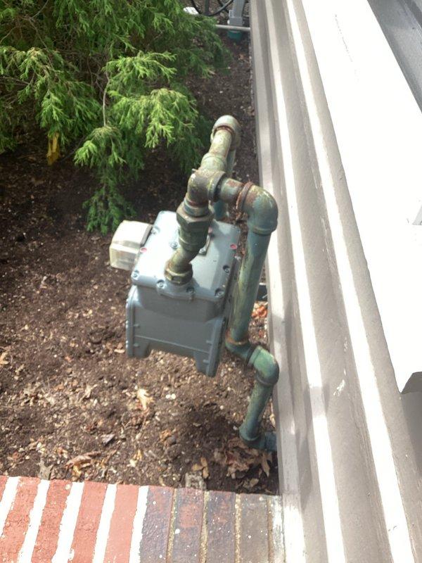 Conducted on-site assessment for new Generac generator installation. Evaluated existing electrical service entrance, utility meter location, and available space for generator placement adjacent to building exterior. Documented current gas meter configuration and underground utility routing to determine optimal generator positioning and required transfer switch installation. Photographed existing infrastructure including basement utility runs to assess electrical panel accessibility and plan for automatic transfer switch wiring. Provided comprehensive quote for complete generator system installation including all necessary electrical connections and permits.