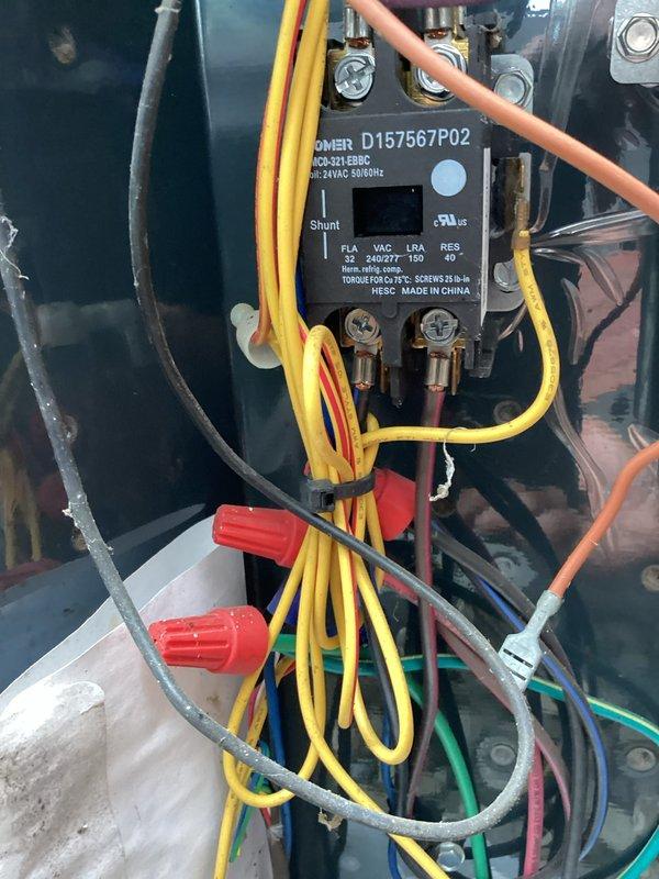 Completed routine HVAC cooling maintenance on system. Inspected electrical contactor and control components, verified proper wire connections and terminations, and confirmed all electrical specifications were within normal operating parameters. Measured supply air temperature at 56.9°F, indicating system is cooling effectively and operating as designed.