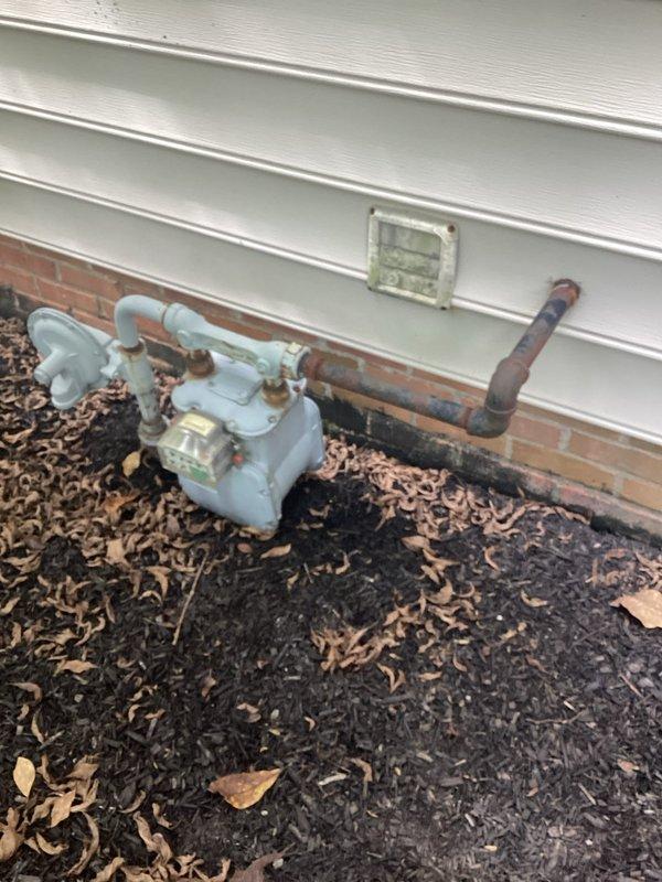 Conducted comprehensive site assessment for 12kW standby generator installation. Evaluated existing natural gas service connection, measured installation clearances from structure and landscaping, and documented foundation access points and utility routing pathways for electrical and fuel line connections.