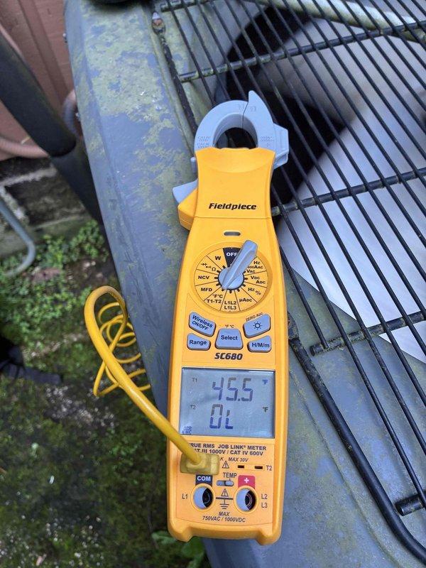 # HVAC Cooling Maintenance Summary

Performed scheduled preventive maintenance on residential air conditioning system. Upon arrival, conducted visual inspection of outdoor condenser unit, which revealed significant biological growth and debris accumulation on exterior grilles and metal surfaces. Utilized Fieldpiece SC680 clamp meter to measure electrical parameters, recording compressor amperage at 455 amps with overload condition detected. Documented equipment condition through photographic evidence showing mold/algae contamination on ventilation louvers and condenser components, indicating extended exposure to moisture without recent servicing.

# Detailed Service Description

Completed comprehensive cooling system maintenance visit on residential HVAC equipment as part of ongoing preventive maintenance program. Initial visual assessment identified outdoor condenser unit requiring attention due to environmental contamination and operational concerns.

**Inspection Findings:**

The ou