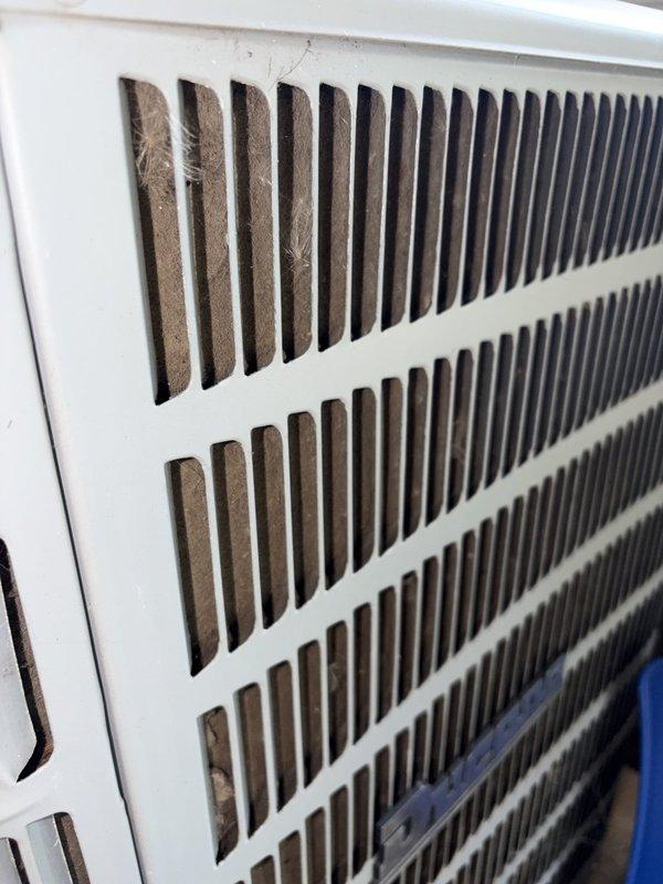 Completed scheduled cooling system maintenance visit as part of ongoing preventative maintenance program. Inspected and documented blower assembly, noting dust accumulation on squirrel cage fan blades and housing. Examined air return grille and filter, observing moderate dust and debris buildup on filter media requiring attention during routine service intervals.