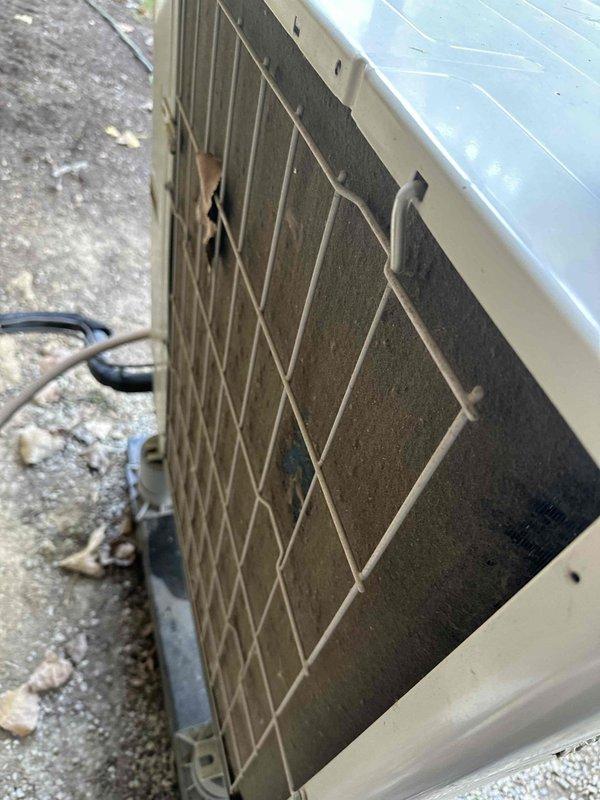 # HVAC Cooling System Maintenance

Completed routine preventive maintenance on residential split-system air conditioning unit. Performed comprehensive inspection of indoor air handler assembly, including electrical connections, control circuitry, and evaporator coil. Verified proper operation of all electrical components and wiring connections within the air handler cabinet. Inspected condensate drain system with PVC piping and confirmed proper drainage function.

Conducted thorough evaluation of outdoor condenser unit, which exhibited significant accumulation of dirt and debris on condenser coils. Coils showed heavy soiling with brownish-gray buildup affecting heat transfer efficiency. Inspected refrigerant line connections, electrical conduit, and unit mounting on concrete pad. Verified structural integrity of protective wire mesh guard and cabinet housing. All system components inspected and maintained per manufacturer specifications to ensure optimal cooling performance for the upc
