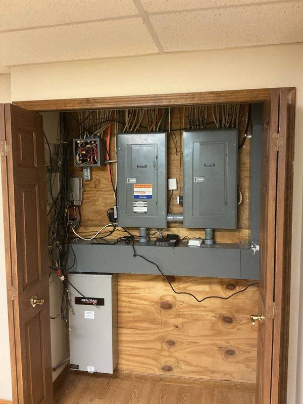 Responded to service call for lighting troubleshooting. Inspected main electrical service panels and associated components within utility closet, verifying proper connections and panel functionality. All electrical equipment, including dual-mounted service panels, surge protection device, and branch circuit wiring, found to be operating within normal parameters with no deficiencies noted.