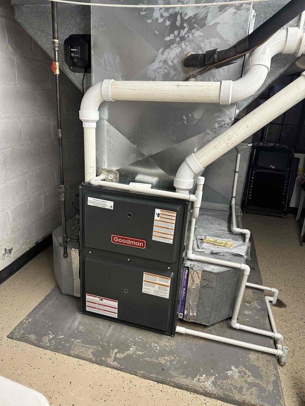 # HVAC Cooling Maintenance Summary

Completed comprehensive cooling system maintenance on residential split-system air conditioning unit. Performed routine inspection and servicing of Amana outdoor condenser unit and Goodman indoor furnace/air handler located in basement mechanical room. System operational and ready for continued cooling season use.

# Detailed Service Description

Performed scheduled preventative maintenance on residential cooling system consisting of outdoor Amana condenser unit and indoor Goodman air handler with integrated furnace.

**Outdoor Condenser Unit Service:**
Inspected Amana condenser unit positioned on concrete pad at exterior wall. Verified unit mounting stability and proper clearances for adequate airflow. Examined cabinet condition, noting intact louvered panels and protective top cover. Checked electrical disconnect box and conduit connections for secure mounting and proper operation. Assessed surrounding area, confirming adequate drainage and minimal